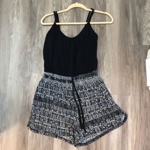 Black romper with design on bottom